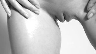 Stunning blonde Darina is showing her gorgeous boobs and shaved pussy  in black and white film
