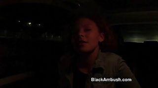 Adorable white teen with curly hair is having sex with a black guy, in a hotel room