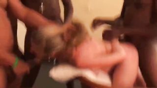 Three black guys are fucking a slutty, Caucasian blonde at the same time, in a hotel room